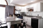 Full Kitchen with Breakfast Bar in History White Mountain Home